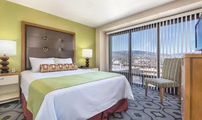 a bedroom with a large bed and a large window at Enjoy all Reno has to offer in this 2BD resort condo with outdoor pool or hot tub in Reno