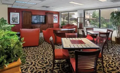 a restaurant with tables and chairs in a room at Enjoy all Reno has to offer in this 2BD resort condo with outdoor pool or hot tub in Reno