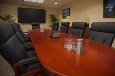 a conference room with a wooden table and chairs at Marriott Grand Residences Luxury 1BD in South Lake Tahoe