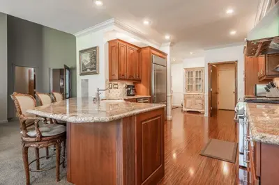 a kitchen with wooden cabinets and a counter top at Snowcreek IV 525 in Mammoth Lakes