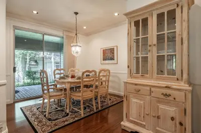 a dining room with a table and chairs and a hutch at Snowcreek IV 525 in Mammoth Lakes