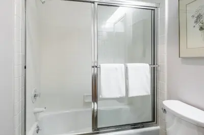 a bathroom with a shower with a glass door at Snowcreek IV 525 in Mammoth Lakes