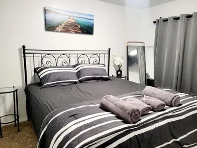 a bedroom with a bed with pillows on it at -Serendipity Lodge at Yosemite- BBQ-Full Kitchen-King Bed in Oakhurst