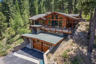 an overhead view of a large wooden house in the woods at Compass Luxury Lodge - Access to HOA and Free Shuttle! in Truckee