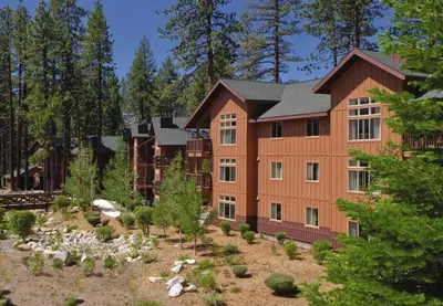 an exterior view of a large building with trees at Wyndham South Shore 1Bd- sleeps 4 in Zephyr Cove