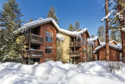 a large building with snow in front of it at Wyndham South Shore 2bd sleeps 6 in Zephyr Cove