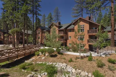 an exterior view of an apartment building with a bridge at Worldmark South Shore 2bd- sleeps 6 in Zephyr Cove