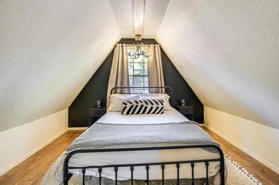 a bedroom with a bed in a attic at Hike, Ski and Fish Charming Cabin in Twain Harte! in Twain Harte