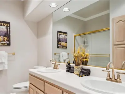 a bathroom with two sinks and a mirror at The Royal Canterbury Retreat - Near Kings Beach & Lake Tahoe in Kings Beach