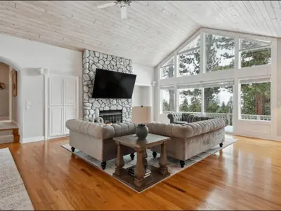 a living room with a couch and a fireplace at The Royal Canterbury Retreat - Near Kings Beach & Lake Tahoe in Kings Beach