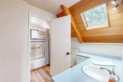 a bathroom with a sink and a window at Lakeview Cabin in Tahoma