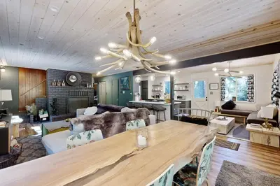 a large living room with a large wooden table at 3 Mi to State Park Quiet Escape with Deck in Arnold in Dorrington