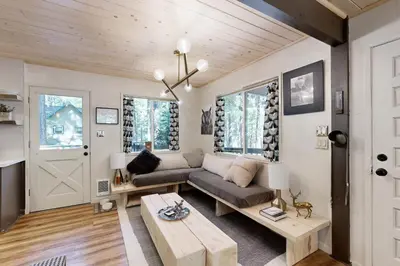 a living room with a couch and a table at 3 Mi to State Park Quiet Escape with Deck in Arnold in Dorrington