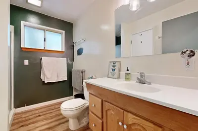 a bathroom with a sink and a toilet and a mirror at 3 Mi to State Park Quiet Escape with Deck in Arnold in Dorrington