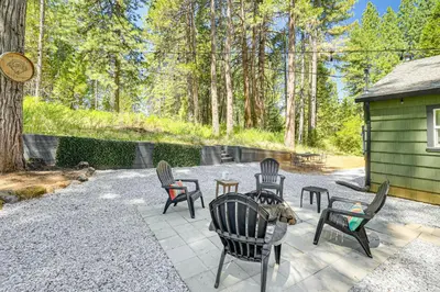 a group of chairs and tables on a patio at Walk to Winery Cozy Cabin with Fire Pit in Murphys in Murphys