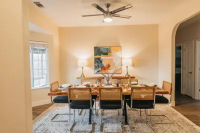 a dining room with a table and chairs at Panoramic Lookout Sierra Serenity BBQ by CasaOso in Mariposa