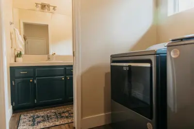 a kitchen with a sink and a microwave at Panoramic Lookout Sierra Serenity BBQ by CasaOso in Mariposa