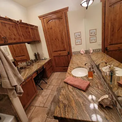 a bathroom with a sink and a counter top at Kings River Reflections in Sanger