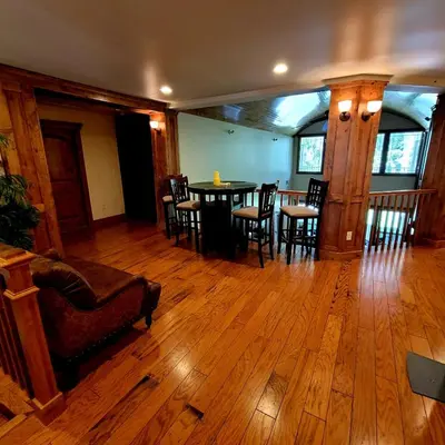 a living room with a table and chairs at Kings River Reflections in Sanger