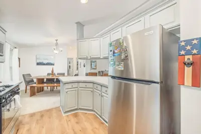 a kitchen with a stainless steel refrigerator at HIlltop Oasis with games, hot tub, Fire-pit, Deck, Views in Oakhurst