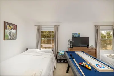 a bedroom with a pool table in the middle of it at HIlltop Oasis with games, hot tub, Fire-pit, Deck, Views in Oakhurst