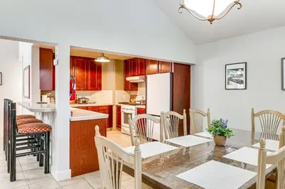a kitchen and dining room with a table and chairs at Forest-View Haven with Game Room Tahoe City Gem! in Tahoe City