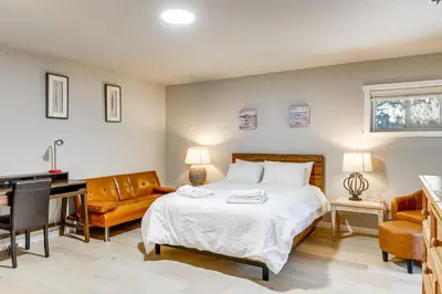 a bedroom with a bed and a desk and a couch at Forest-View Haven with Game Room Tahoe City Gem! in Tahoe City