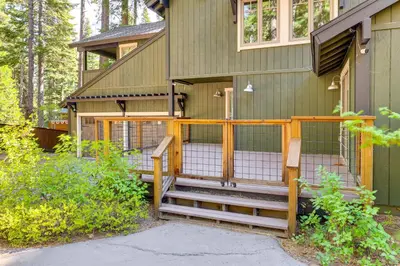 a house with a gate and stairs leading up to it at Forest-View Haven with Game Room Tahoe City Gem! in Tahoe City