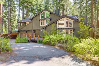 a house in the middle of a forest at Forest-View Haven with Game Room Tahoe City Gem! in Tahoe City