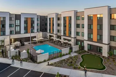 an aerial view of a building with a pool at Residence Inn by Marriott Sacramento Cal Expo in Sacramento