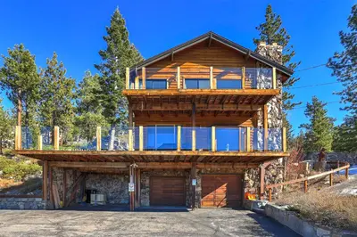 a wooden house with a balcony on top of it at Tallac View in Stateline