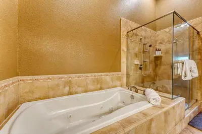 a large bathroom with a tub and a shower at Luxe All-Season Retreat by AvantStay Prime Location Near Skiing in Truckee