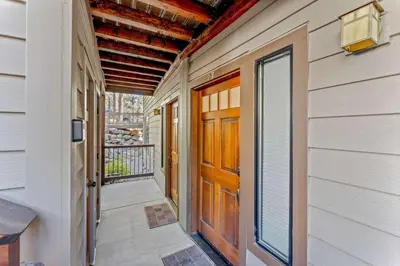 a door to a house with a porch at Lake Tahoe Vacation Rental w Patio & Pool Access in Kings Beach