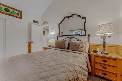 a bedroom with a bed and a large mirror at Carnelian Bay 3BR + Loft Near Beach & Trails in Carnelian Bay