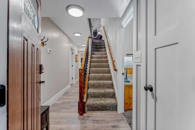 a hallway with a staircase in a house at Carnelian Bay 3BR + Loft Near Beach & Trails in Carnelian Bay