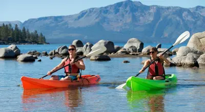 two people in kayaks on a body of water at Lv12 luxury villa with hot tub, close to skiing in Glenbrook