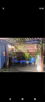 a group of blue chairs sitting in front of a building at Ping's Tiny Home self-check in & out private in Merced