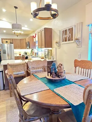 a kitchen and dining room with a table and chairs at The Aspen House in Tahoma