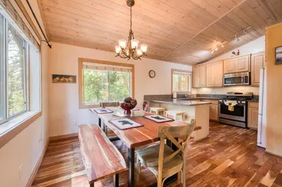 a dining room with a table and chairs in a kitchen at Landfall on the North Shore - Fenced Yard, Walking Distance to Lake in Kings Beach
