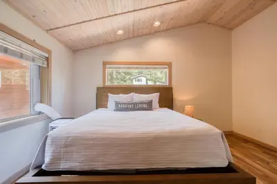 a bedroom with a bed and a window at Landfall on the North Shore - Fenced Yard, Walking Distance to Lake in Kings Beach