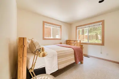 a bedroom with a bed and a window at Landfall on the North Shore - Fenced Yard, Walking Distance to Lake in Kings Beach