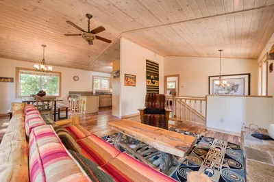 a living room with a couch and a table at Landfall on the North Shore - Fenced Yard, Walking Distance to Lake in Kings Beach