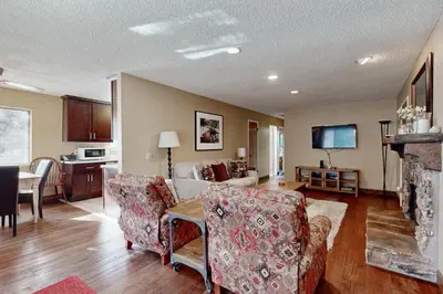 a living room with a couch and a table with chairs at Incline Haven in Incline Village