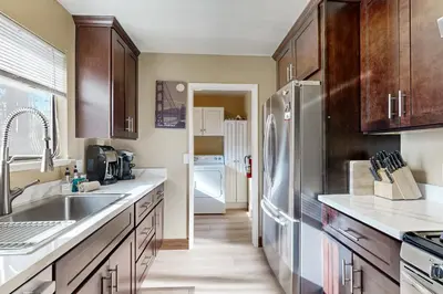 a kitchen with wooden cabinets and a stainless steel refrigerator at Incline Haven in Incline Village
