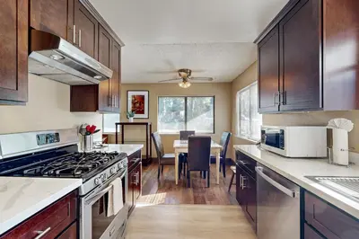 a kitchen with wooden cabinets and a dining room at Incline Haven in Incline Village