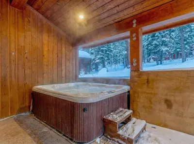a hot tub in a room with a window at Northstar Hideaway-Private Hot Tub, Shuttle Access in Truckee