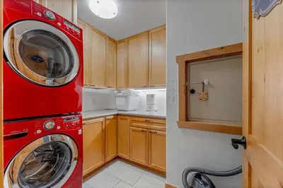 a red washer and dryer in a small kitchen at Northstar Hideaway-Private Hot Tub, Shuttle Access in Truckee