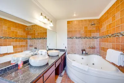 a bathroom with two sinks and two tub at Scenic Home with Sauna - 7 Mi to Heavenly Mountain! in Kingsbury