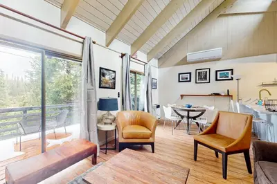 a living room with a table and chairs at Snowy Pines in Fish Camp
