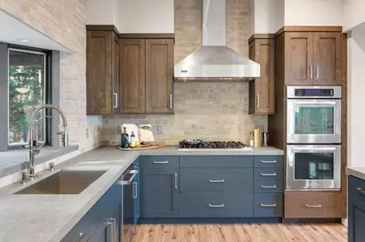 a kitchen with blue cabinets and a sink at Luxury Tahoe Vacation Rental with HotTub & Lake Views in Tahoe Vista